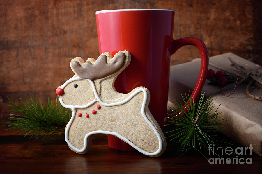 Reindeer Cookie and Coffee Cup.  Photograph by Milleflore Images