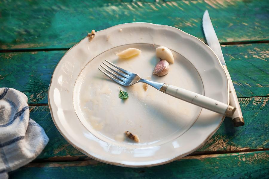 Remains Of Food On An Empty Plate Photograph by Piga & Catalano S.n.c.
