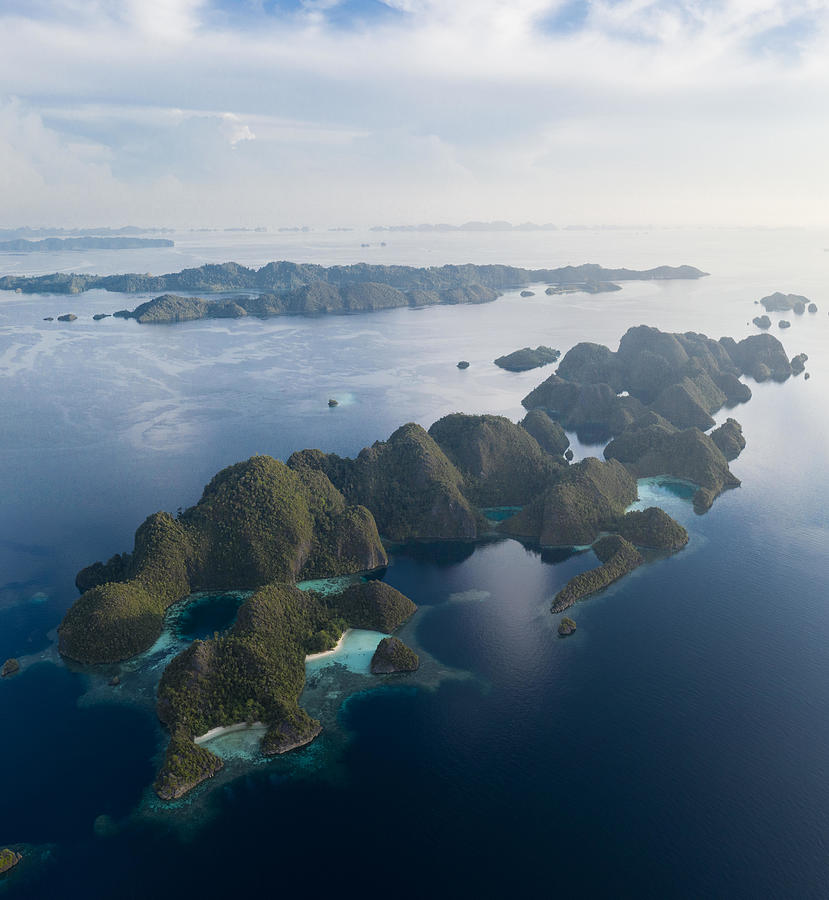 Nature Photograph - Remote Limestone Islands In Raja Ampat by Ethan Daniels