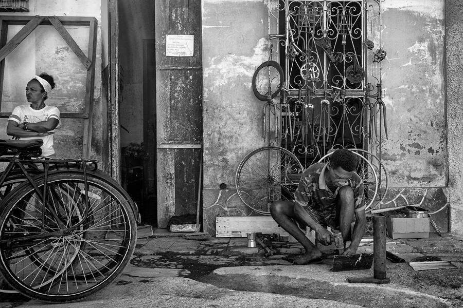 Repairing Bicycle Photograph by Nevra Topalismailoglu