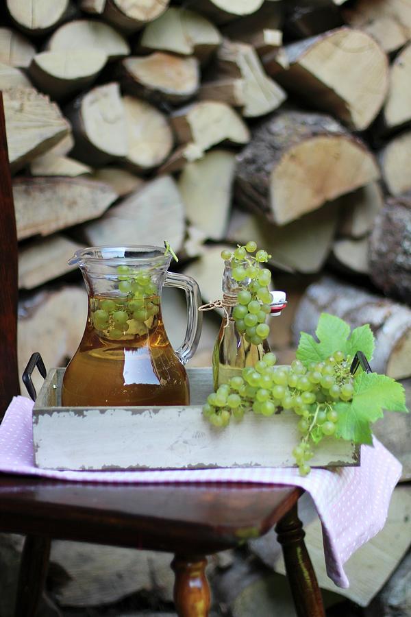 Reproduced In A Jar And A Flip-top Glass Bottle On A Tray Outdoors Photograph by Sylvia E.k Photography