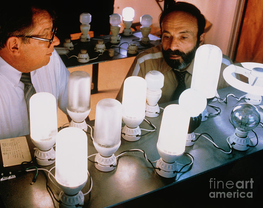 Researchers With Energy-saving Light Bulbs Photograph by Us Department Of Energy/science Photo Library