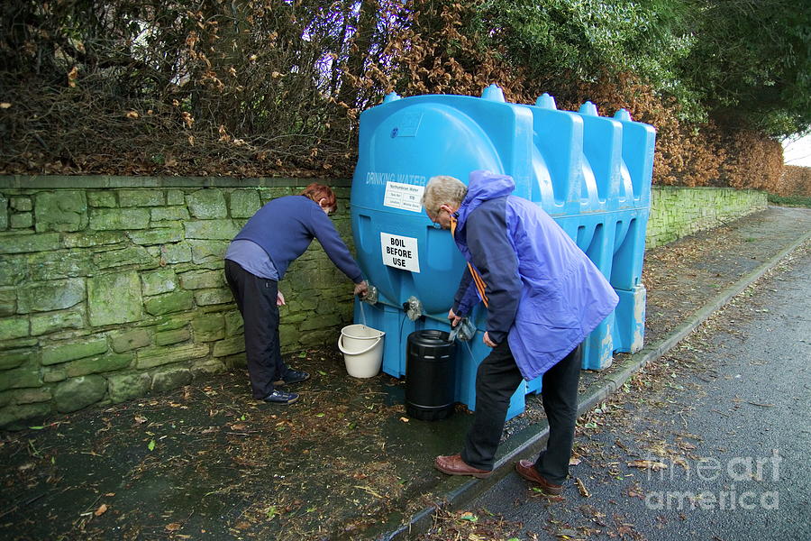 Winter Photograph - Resident Collecting Water by Simon Fraser/science Photo Library