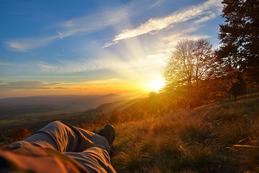 Sunset Photograph - Resting On Top Of The Mountain In Warm by Daniel Chetroni