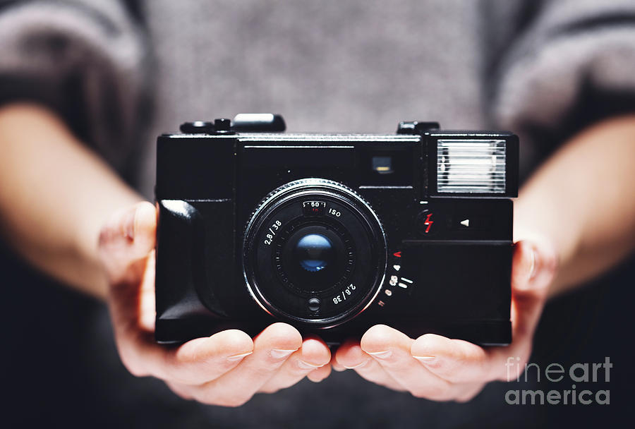 Retro Camera In Womans Hands. Photography Photograph