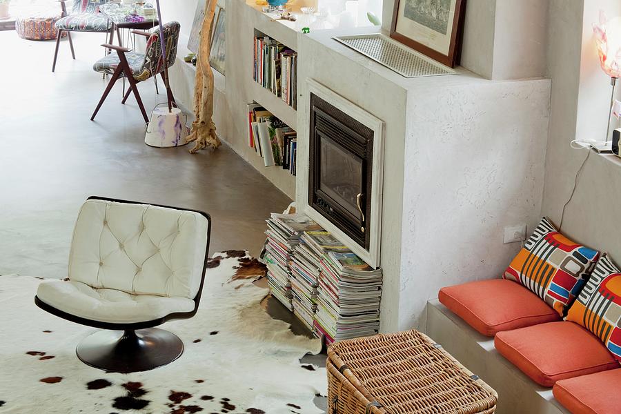 Retro Swivel Chair In Front Of Masonry Fireplace With Adjacent Bench by Fabio Lombrici