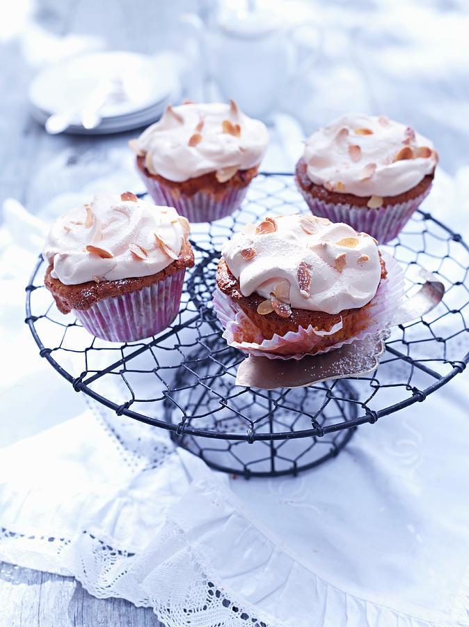 Rhubarb Cupcakes With Meringue And Flaked Almonds Photograph by Oliver Brachat