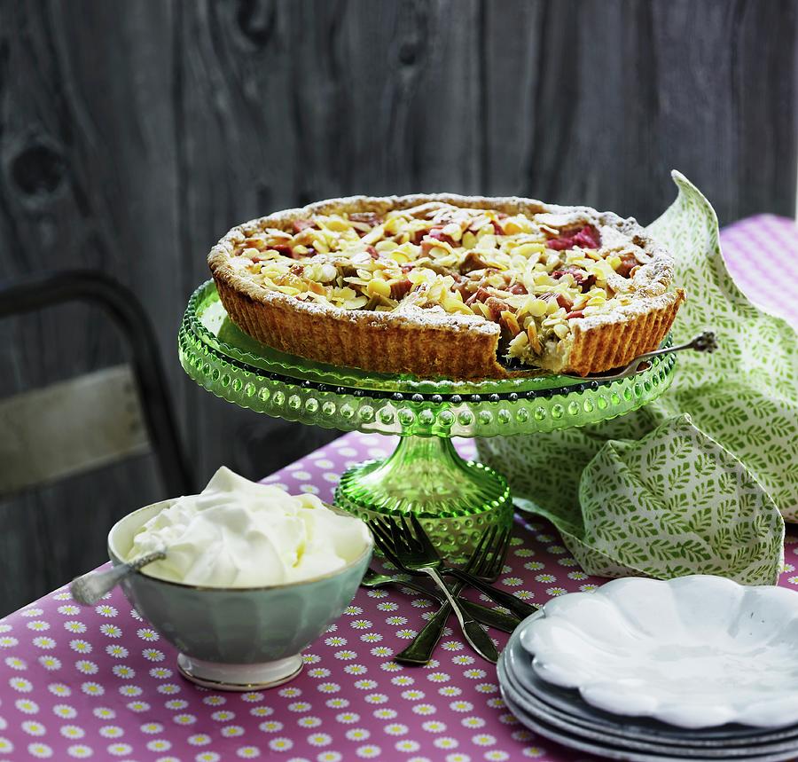 Rhubarb Tart With Almonds On A Cake Stand Served With Whipped Cream Photograph by Mikkel Adsbl