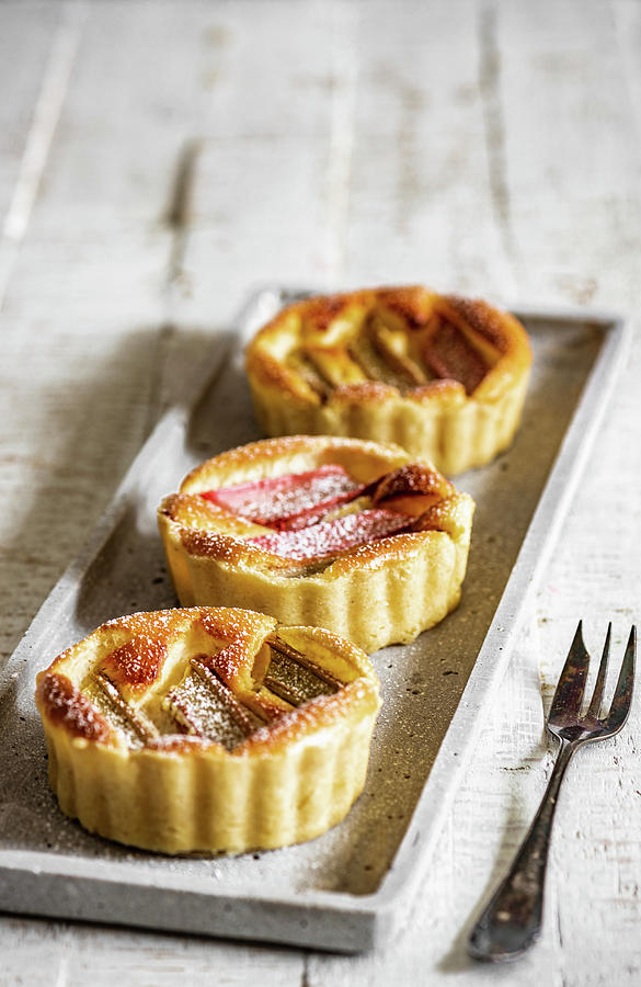 Rhubarb Tartlets With Icing Sugar Photograph by M. Nlke