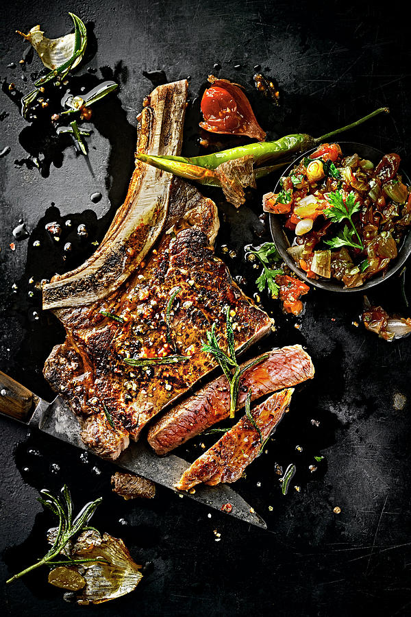 Ribeye Steak With Garlic, Rosemary And Peperoni Photograph by Manfred Rave