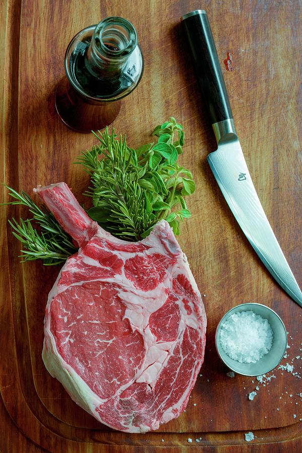 Ribeye Steak With Salt And Fresh Herbs Photograph by Hansen, Steve