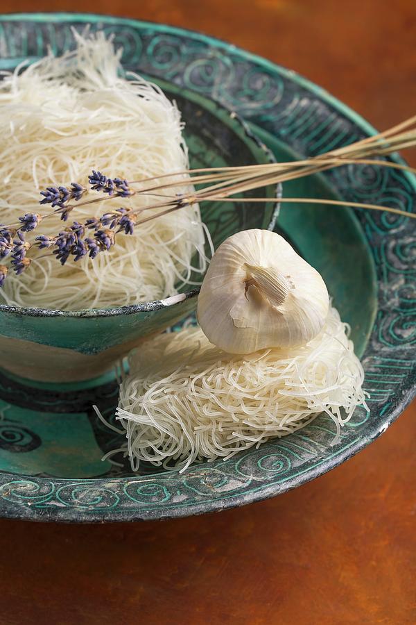 Rice Noodles With Lavender And Garlic In A Ceramic Dish Photograph by Mandy Reschke