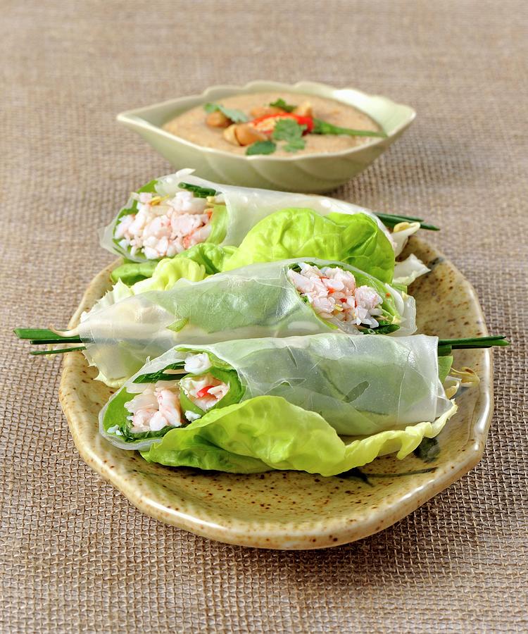 Rice Paper Rolls Filled With Prawns On Lettuce Leaves Photograph by Franco Pizzochero