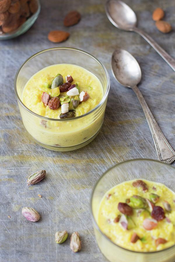 Rice Pudding With Almonds And Pistachios In A Glass Photograph by Alice Del Re