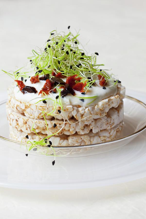 Rice Waffles Topped With Quark, Olives, Dried Tomatoes And Bean Sprouts Photograph by Hilde Mche