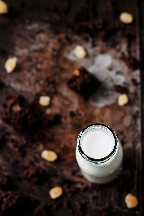 Rich And Moist Gingerbread Cake With Candied Ginger And A Bottle Of Milk Photograph by Federica Dm