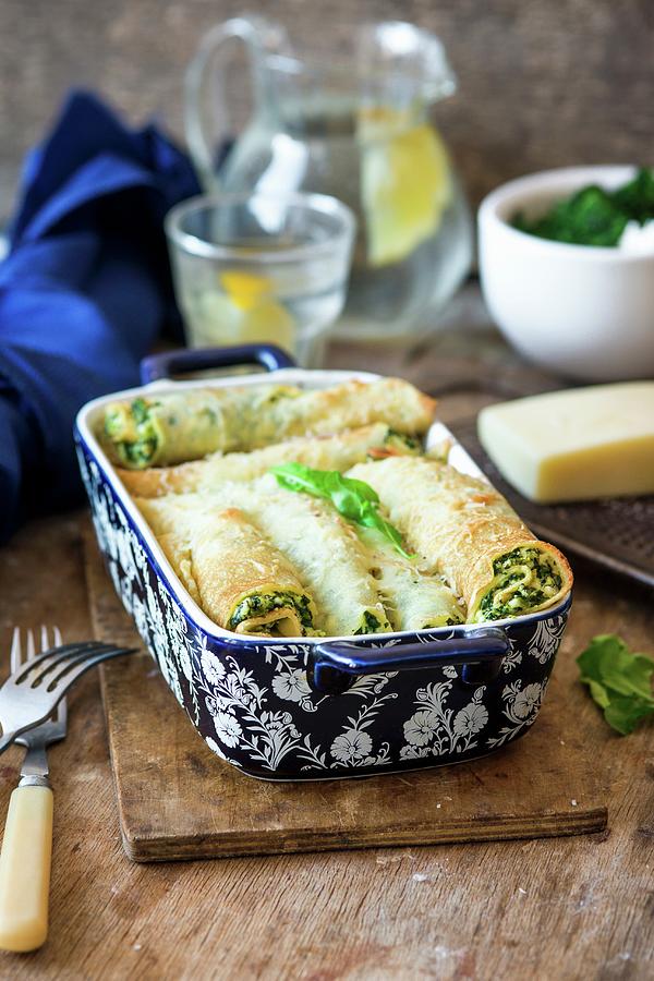 Ricotta And Spinach Crpes With Cheese Melted On The Top Photograph by Irina Meliukh