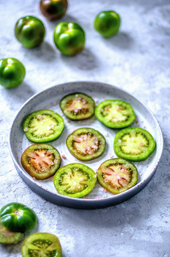 Ringed Green Tomatoes With Large Himalayan Salt Photograph by Gorobina