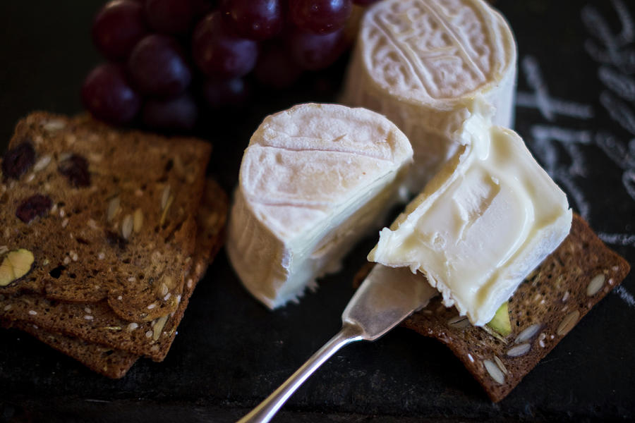 Ripe Goats Cheese And Wholemeal Bread Photograph by Eising Studio