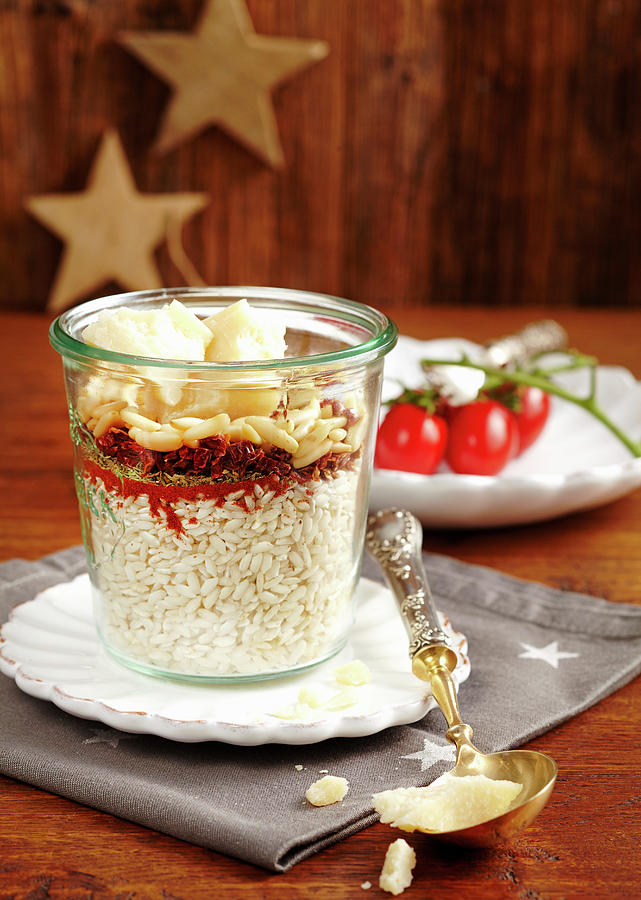 Risotto Mix With Pine Nuts And Dried Tomatoes In A Glass Photograph by Teubner Foodfoto