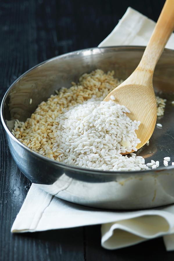 Risotto Rice Being Browned Photograph by Alena Hrbkov