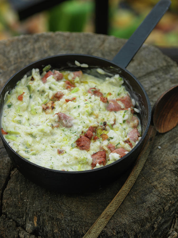 Risotto With Luganighette raw Swiss Sausages And Leek Photograph by Andreas Thumm
