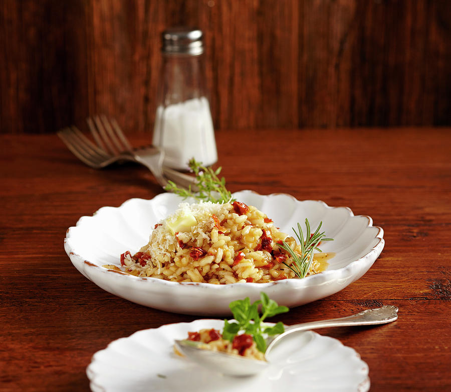 Risotto With Pine Nuts And Dried Tomatoes Photograph by Teubner Foodfoto
