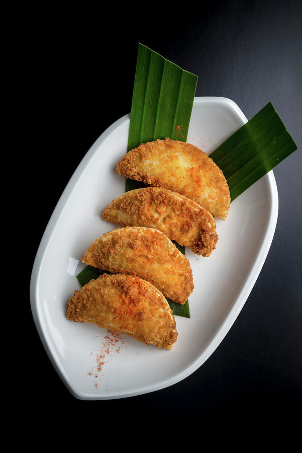 Rissois deep Fried Breaded Pastry Shaped As Half-moon, Filled With Shrimp In Bchamel Sauce Photograph by Nitin Kapoor