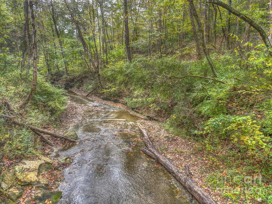 River flowing through Pine Quarry Park Photograph by Jeremy Lankford