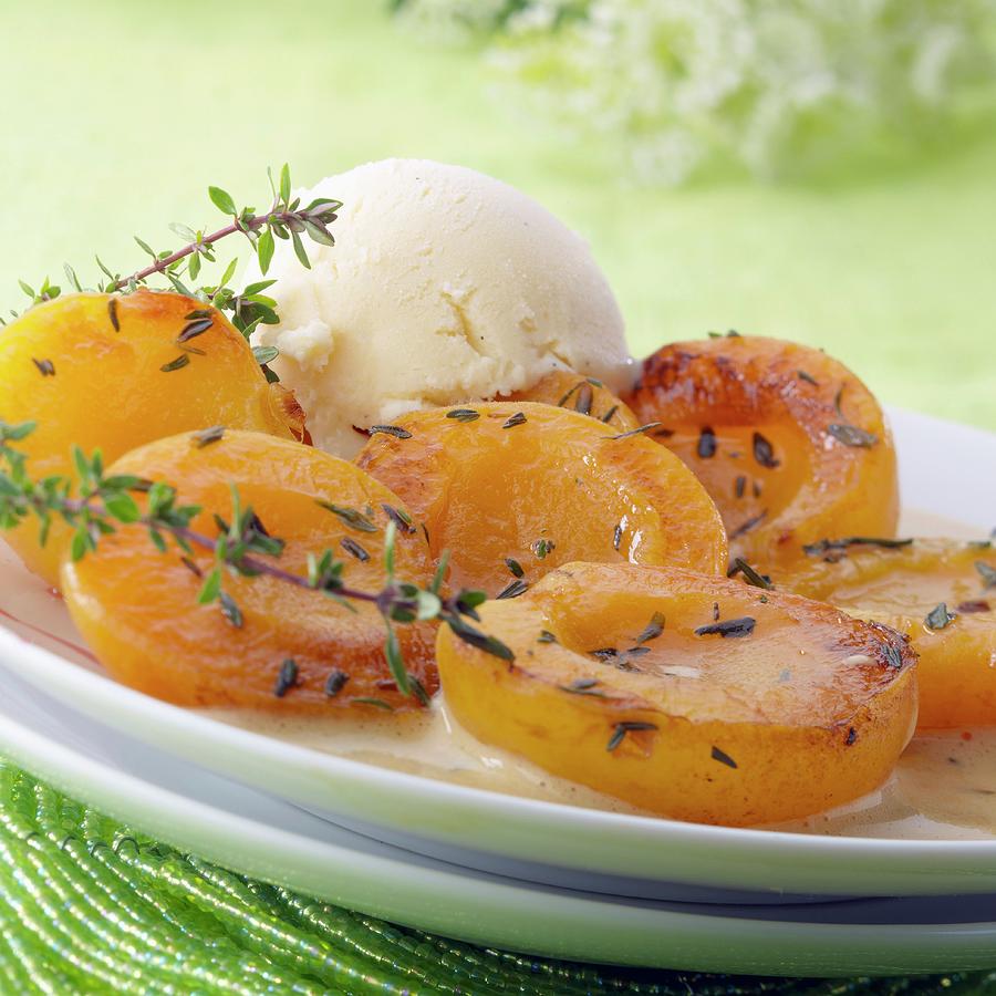 Roast Apricots With Thyme And A Scoop Of Vanilla Ice Cream Photograph by Adam