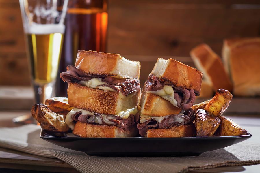 Roast Beef And Cheese Sandwiches With Potato Wedges And Beer Photograph by Brian Enright