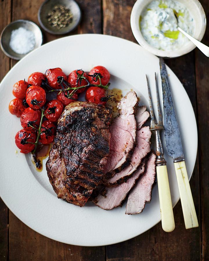 Roast Beef With Cherry Tomatoes And Mint And Garlic Yoghurt Photograph by Tom Regester