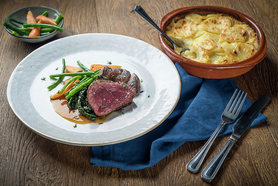 Roast Beef With Vegetables And Potato Gratin Photograph by Giulia Verdinelli Photography