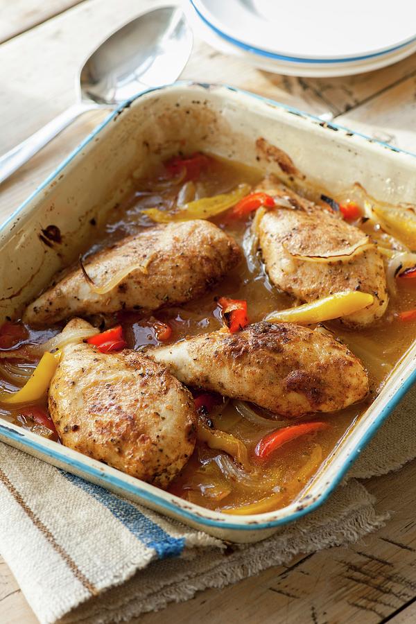 Roast Chicken Breast With Red And Yellow Peppers Photograph by Jonathan Short