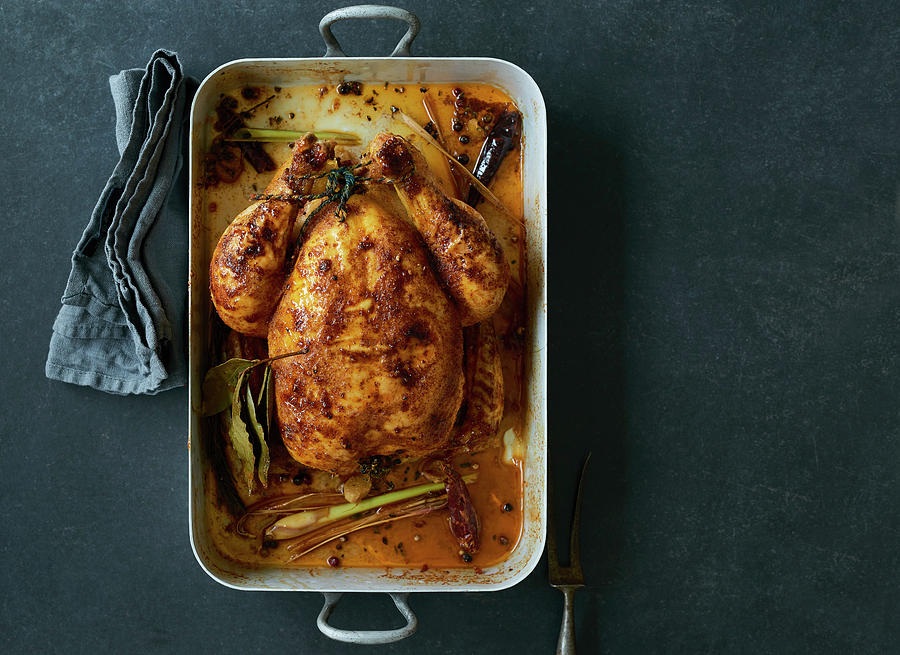 Roast Chicken In A Roasing Tin Photograph by Stefan Schulte-ladbeck