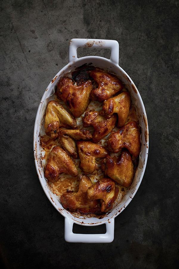 Roast Chicken Wings In A Roasting Tin Photograph by Bernhard Winkelmann