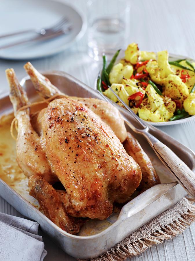Roast Chicken With A Cauliflower Salad Photograph by Charlie Richards