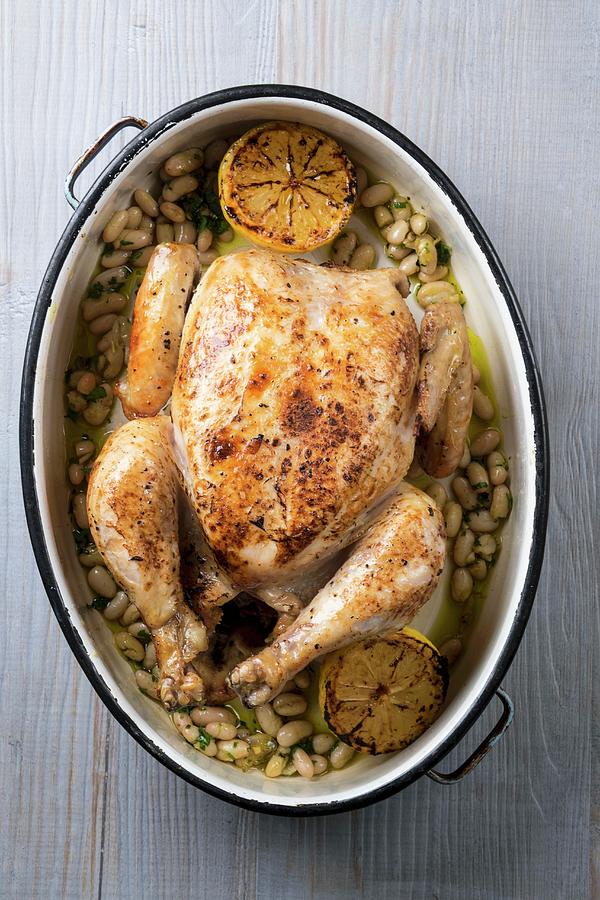 Roast Chicken With Lemon And White Beans Photograph by Adrian Britton