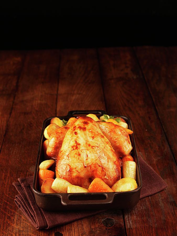 Roast Chicken With Root Vegetables In A Roasting Tin Photograph by