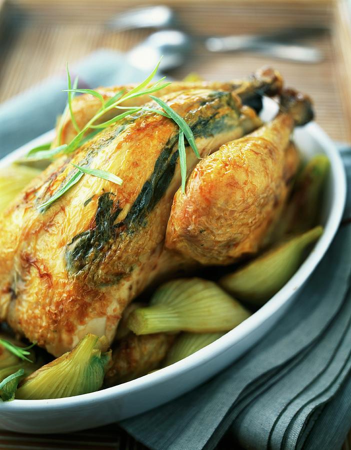 Roast Chicken With Tarragon Under Its Skin And Fennel Photograph by Roulier-turiot