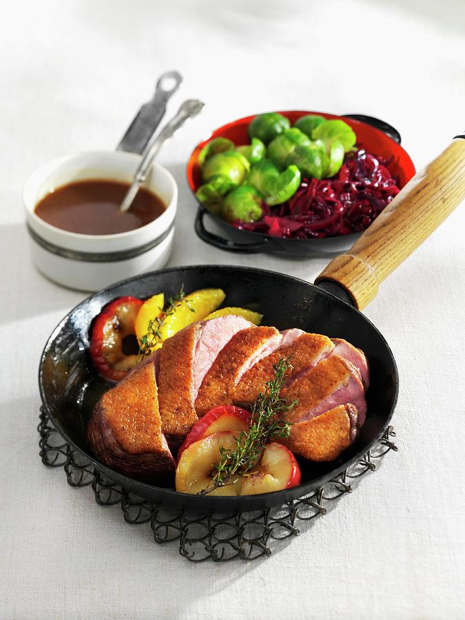 Roast Duck Breast With Brussels Sprouts And Apple Red Cabbage Photograph by Karl Newedel