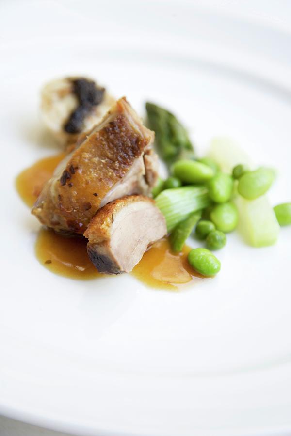 Roast Duck In Dandelion Honey With Brioche Dumplings And Spring Vegetables Photograph by Michael Wissing