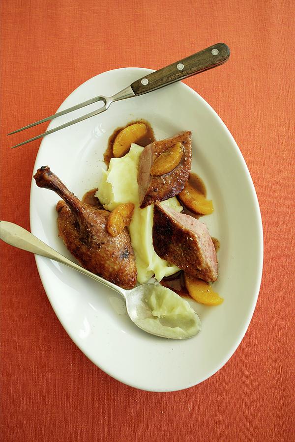 Roast Duck With An Orange And Ginger Sauce With Mashed Potatoes Photograph by Michael Wissing