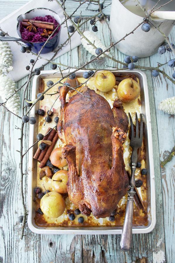 Roast Duck With Apples And Sloes Photograph by Martina Schindler