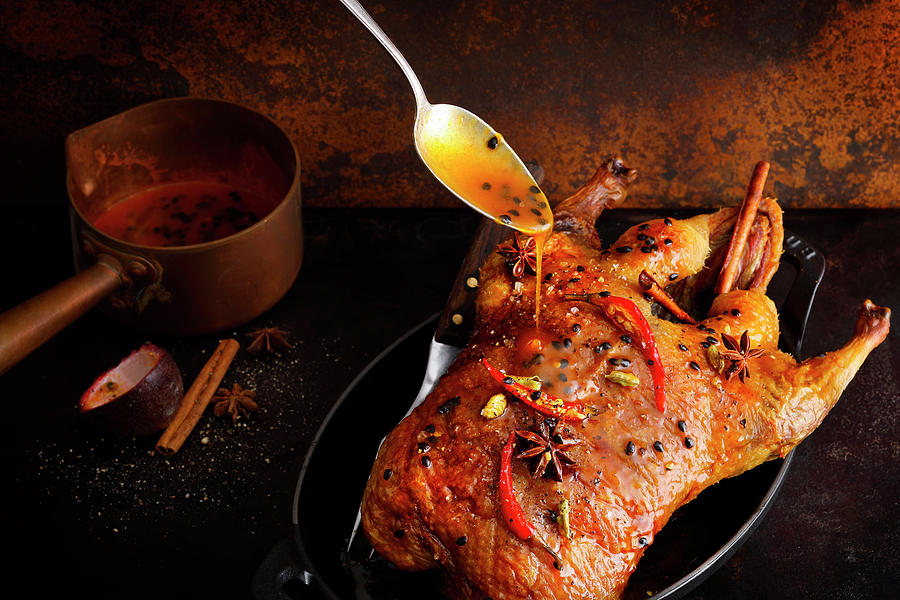 Roast Duck With Christmas Spices And Chilli Peppers Photograph by Jalag / Mathias Neubauer