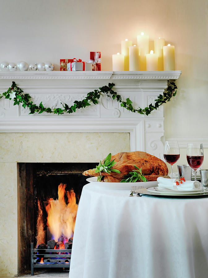 Roast Goose With Sage On Table By Fireplace Photograph by Michael Paul