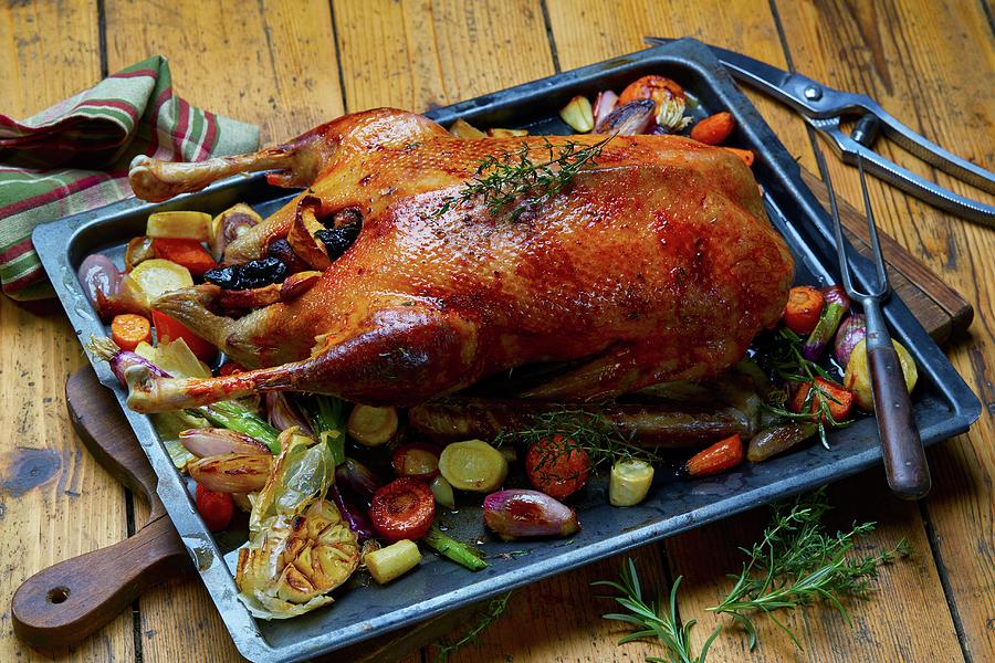 Roast Goose With Vegetables On An Oven Tray Photograph by Frank Weymann