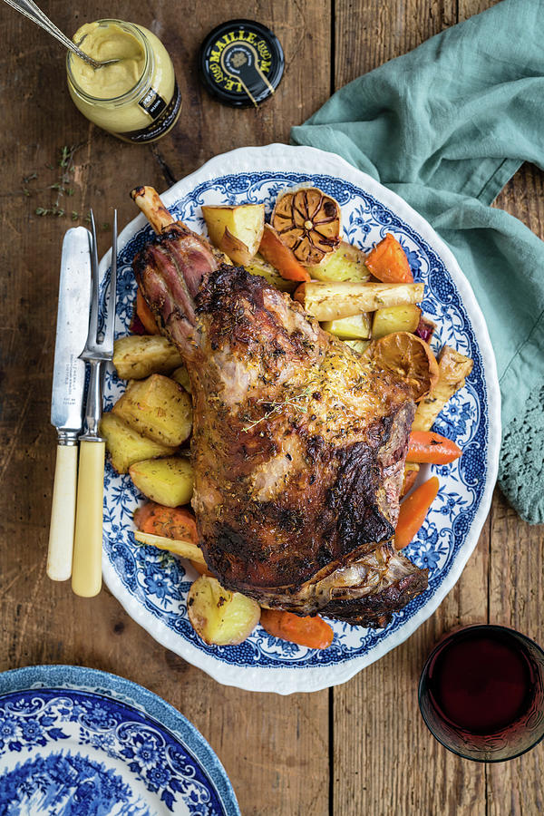Roast Lamb On A Bed Of Vegetables Photograph by Lucy Parissi