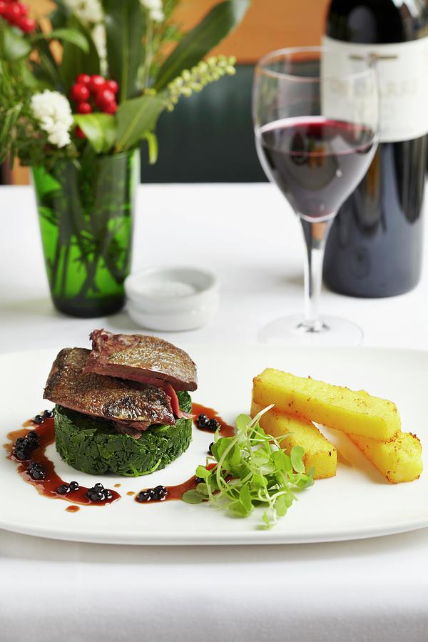 Roast Lamb On A Spinach Timable With Polenta Sticks And Blackcurrant Jus Photograph by Charlotte Tolhurst