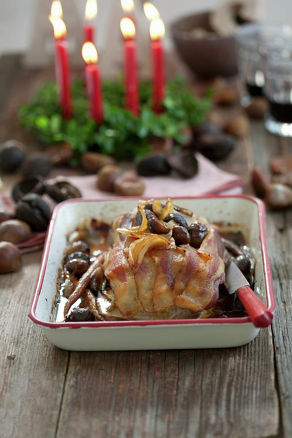 Roast Pork In Bacon With Chestnuts Photograph by Schindler, Martina